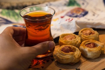 .tea, bagel, hot dog puff pastry concept