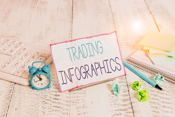 Word writing text Trading Infographics. Business photo showcasing visual representation of trade information or data Notepaper stand on buffer wire in between computer keyboard and math sheets