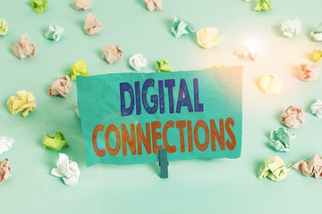 Word writing text Digital Connections. Business photo showcasing the online way to explore and build relationships Colored crumpled papers empty reminder blue floor background clothespin
