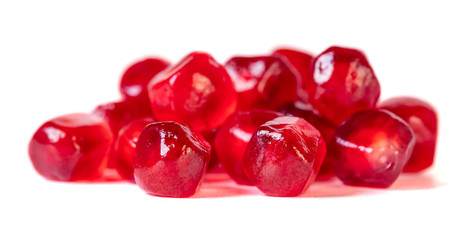 Fresh pomegranate seeds isolated on white background. Close up.