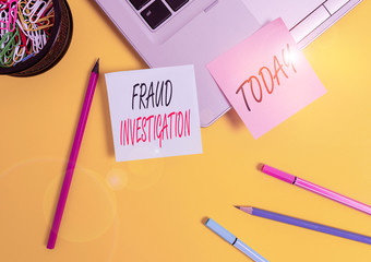 Conceptual hand writing showing Fraud Investigation. Concept meaning process of determining whether a scam has taken place Laptop sticky notes container pencils markers colored background
