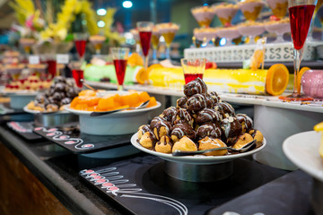 A delicious dessert buffet with various sweet bakery in a restaurant or hotel