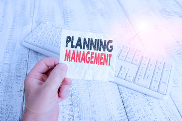 Writing note showing Planning Management. Business concept for act or process of making or carrying...