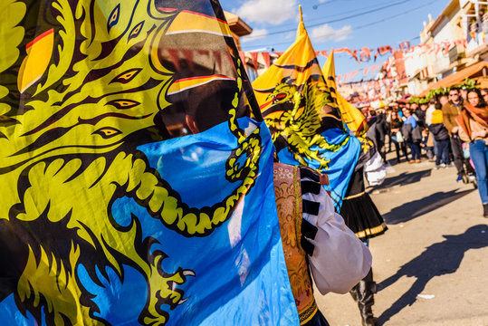 Flags of the brotherhood of Sbandieratori Di Fivizzano parading in a medieval festival.