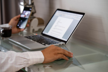 Man is working at home through social media.