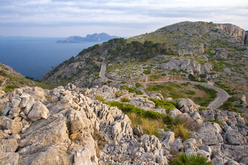Fototapeta na wymiar Summer Balearic landscape with beautiful rocks and sea. Beautiful mountain road, mountain serpentine. Mallorca - Cap de Formentor.