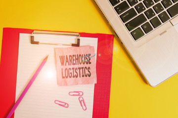 Writing note showing Warehouse Logistics. Business concept for flow of both physical goods and information in business Laptop clipboard paper sheet clips pencil crushed colored background