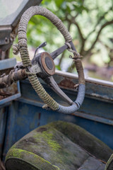 Steering wheel inside the old car.