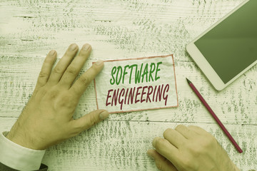 Conceptual hand writing showing Software Engineering. Concept meaning apply engineering to the...