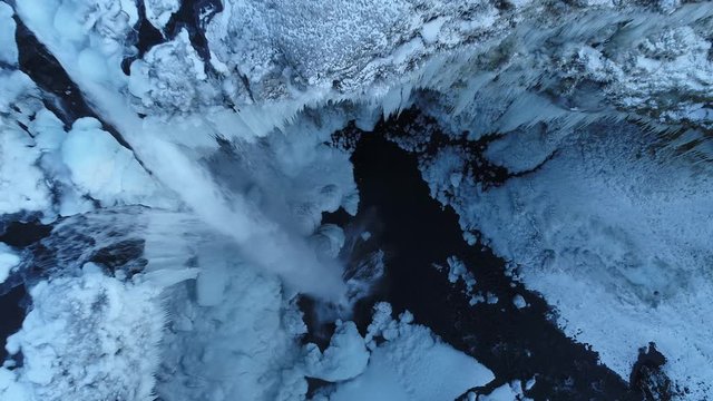 Mysterious Secret frozen Waterfall in Iceland zoom in