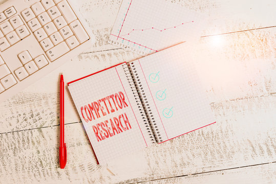 Conceptual hand writing showing Competitor Research. Concept meaning collection and review of information about rival firms Papercraft desk square spiral notebook office study supplies