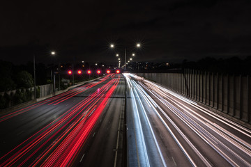 Fototapeta na wymiar Light trails from cars and trucks travelling on a Freeway
