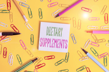 Handwriting text writing Dietary Supplements. Conceptual photo Product taken orally intended to...
