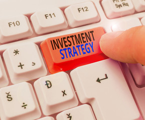 Handwriting text writing Investment Strategy. Conceptual photo the systematic plan to allocate...
