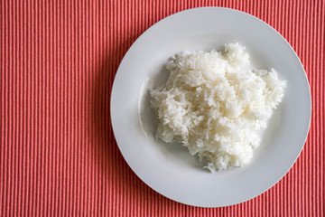 Steam rice on pink mat