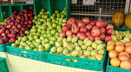 Fruits and Vegetables on the Counter of a Greengrocer's Shop. The photo was taken on the street.