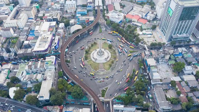 aerial top view traffic road roundabout in city at night, Time lapse top road in bangkok.