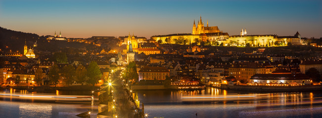 Prague - The Charles Bridge, Castle and Cathedral withe the Vltava river at dusk.