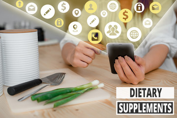 Writing note showing Dietary Supplements. Business concept for Product taken orally intended to...