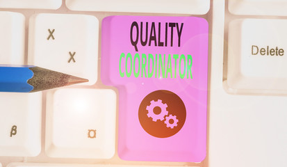 Handwriting text writing Quality Coordinator. Conceptual photo monitor and improve the quality of...