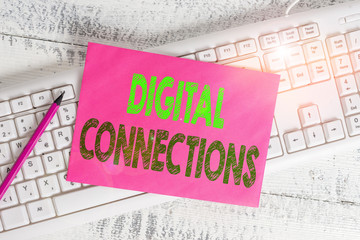 Handwriting text writing Digital Connections. Conceptual photo the online way to explore and build relationships White keyboard office supplies empty rectangle shaped paper reminder wood