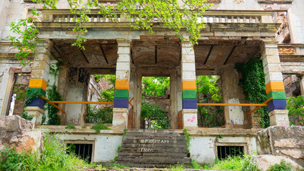 Mostar, Bosnia and Herzegovina - April 2019: Palace bombed during the 1992-1995 Bosnian War facing the Zrinjski City Park, a public park on the western side of the city of Mostar. 