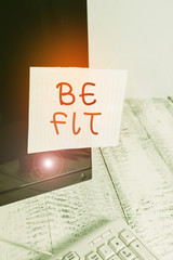 Text sign showing Be Fit. Business photo text of a suitable quality standard or type to meet the required purpose Notation paper taped to black computer monitor screen near white keyboard