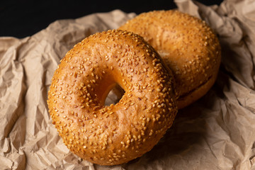 Sesame bagels on dark background