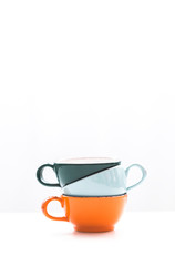 Hill of cups of coffee on white background.