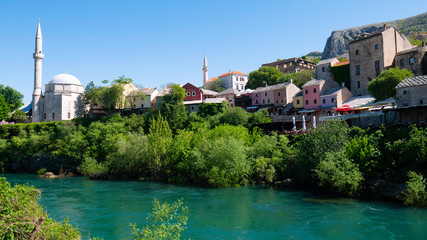Fototapeta premium View from the Neretva River to the old town of Mostar, Bosnia and Herzegovina, April 2019.