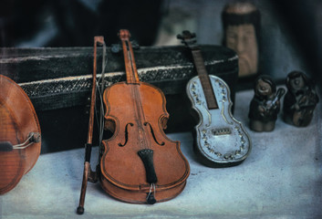 Fototapeta na wymiar Old musical instruments - violins and cello