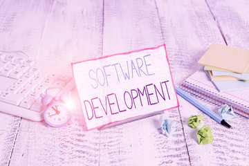 Word writing text Software Development. Business photo showcasing software is created using a...