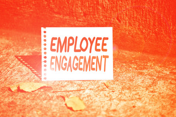 Handwriting text Employee Engagement. Conceptual photo relationship between an organization and its employees Empty Spiral Bound Notebook Sheet Torn Off Folded in Half Dried Leaves