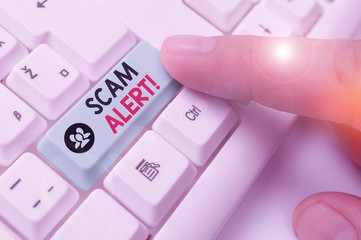 Handwriting text Scam Alert. Conceptual photo fraudulently obtain money from victim by persuading...