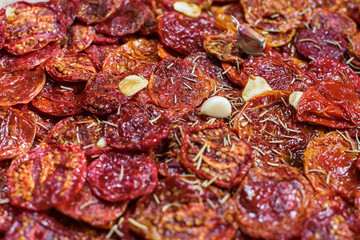 Tasty dried tomatoes as background. Top view