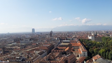 Obraz premium Turin, Italy - 01/004/2019: Beautiful panoramic view from Mole Antoneliana to the city of Turin in winter days with clear blue sky and the alps in the background. 