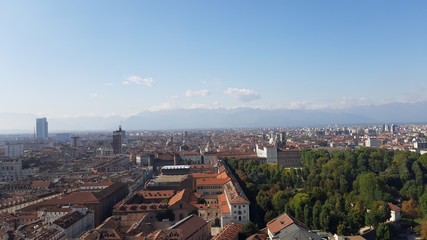 Turin, Italy - 01/004/2019: Beautiful panoramic view from Mole Antoneliana to the city of Turin in winter days with clear blue sky and the alps in the background. 