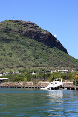A sunken recreational boat in the marina of Port Louis, Mauritius
