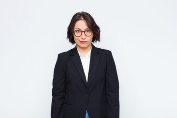 young businesswoman feeling confused and doubtful, wondering or trying to choose or make a decision...