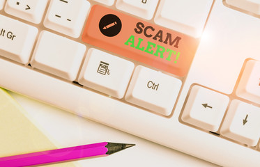 Handwriting text Scam Alert. Conceptual photo fraudulently obtain money from victim by persuading...