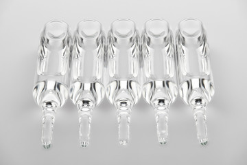 Ampoules. Transparent capsules with liquid on white background. Medicament for health care....