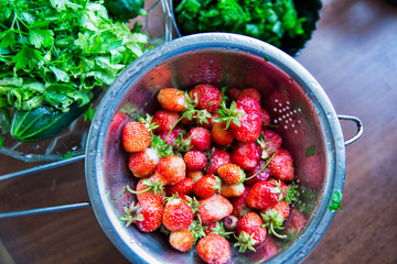 Ripe tasty strawberries in a colander