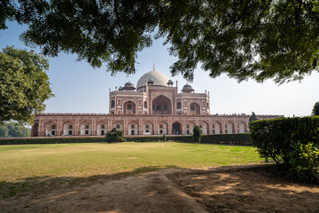 Humayans Tomb as seen framed by trees in New Delhi India