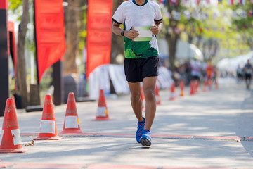 People feet, Marathon running in streets of the park