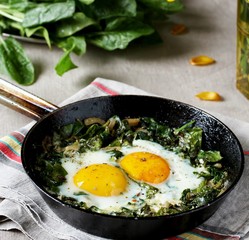 shakshuka with spinach or fried eggs. Green Shakshuka. Cook in Israel. Paleo. Keto diet dish. 