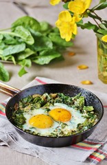 shakshuka with spinach or fried eggs. Green Shakshuka. Cook in Israel. Paleo. Keto diet dish. 
