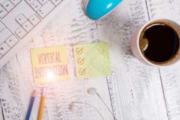 Conceptual hand writing showing Vertical Integration. Concept meaning Merger of companies at...