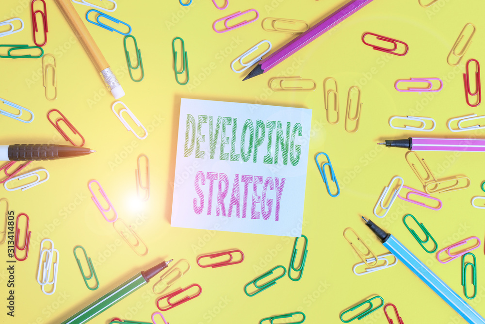 Poster handwriting text writing developing strategy. conceptual photo game plan that sets specific goals an