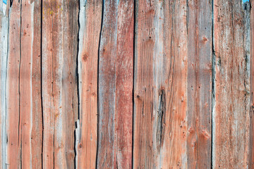 Old shabby wooden planks with cracked color paint
