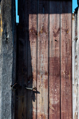 Old rural country door of red color retro rustic